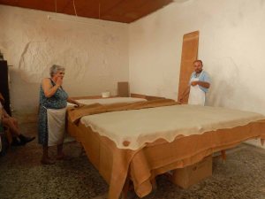 A bakery....that white sheet is the very thin pastry that eventually becomes....BAKLAVA
